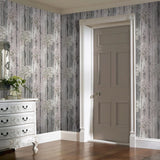 WM90840101 Cherry blossom forest flowering branches gray pink purple tree trunks Wallpaper
