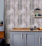 WM90840101 Cherry blossom forest flowering branches gray pink purple tree trunks Wallpaper
