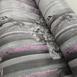 WM90840101 Cherry blossom forest flowering branches gray pink purple tree trunks Wallpaper
