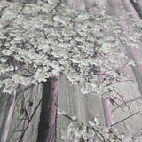 WM90840101 Cherry blossom forest flowering branches gray pink purple tree trunks Wallpaper
